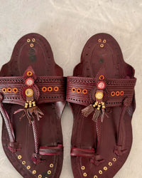 Deccan in maroon with brass eyelets and tassels, pair from above