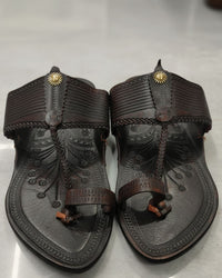Kapshi Classic in deep brown, pair from above on a pale stone floor
